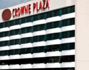 Exterior view of Crowne Plaza Panama showcasing the hotel's modern façade and signature branding.