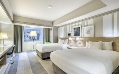 Modern guest room with two queen beds, stylish artwork and a comfortable contemporary design at Royal Sonesta Minneapolis.