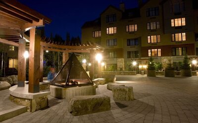 Hotel outdoor with fire place at Hilton Whistler Resort & Spa.