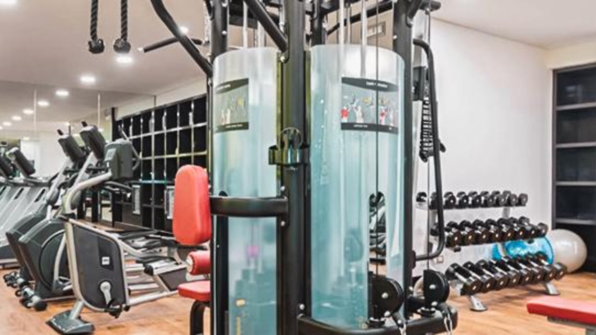 Fitness center at NH Collection Mexico City Centro Histórico featuring cardio machines, strength-training equipment and free weights.