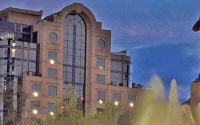 Exterior view of Hotel Marquis Reforma with the hotel building and Diana the Huntress fountain in the foreground.