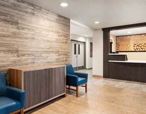 Welcoming lobby featuring contemporary seating, wood-inspired décor and a reception area designed for guest convenience at Candlewood Suites Meridian.