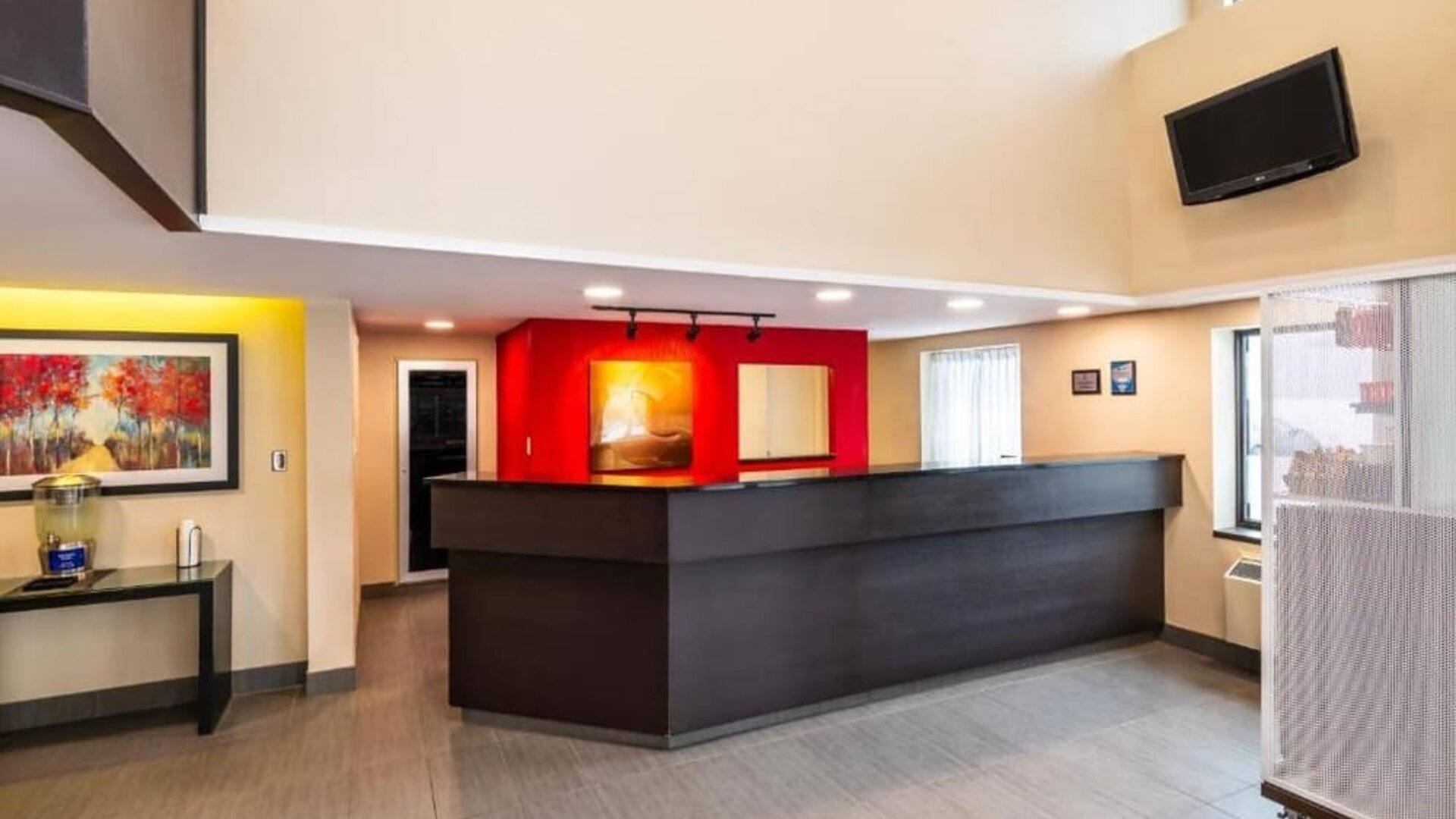 Reception desk featuring modern finishes and a welcoming check-in area at Comfort Inn Truro.