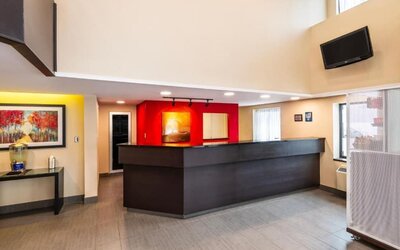 Reception desk featuring modern finishes and a welcoming check-in area at Comfort Inn Truro.