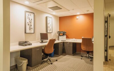 Business center featuring computer workstations, printing services and a dedicated workspace for productivity at Candlewood Suites Boise.