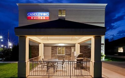 Outdoor terrace featuring covered seating and barbecue facilities for relaxing and outdoor dining at Candlewood Suites Boise.