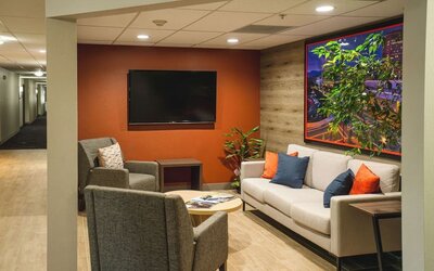 Seating area featuring contemporary furnishings, accent décor and a comfortable space for relaxing or socializing at Candlewood Suites Boise.
