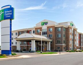 Hotel exterior featuring contemporary architecture, a covered entrance and convenient on-site parking at Holiday Inn Express & Suites Ontario.