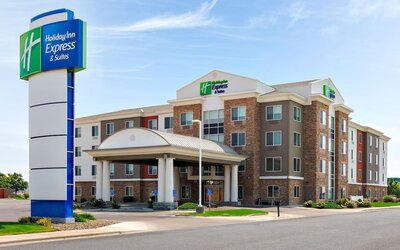 Hotel exterior featuring contemporary architecture, a covered entrance and convenient on-site parking at Holiday Inn Express & Suites Ontario.