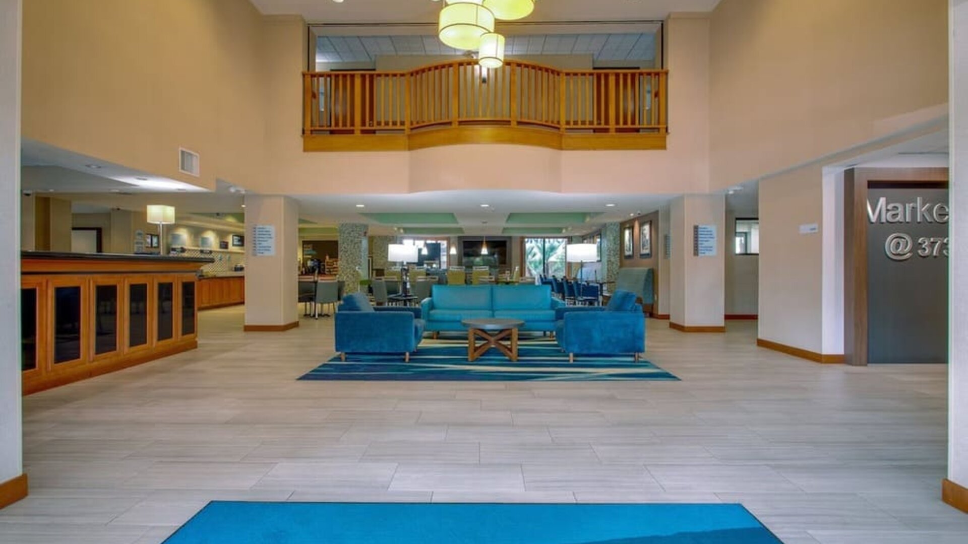 Hotel lobby featuring an open-concept layout, comfortable lounge seating and a bright, welcoming atmosphere at Holiday Inn Express SFO Airport North.
