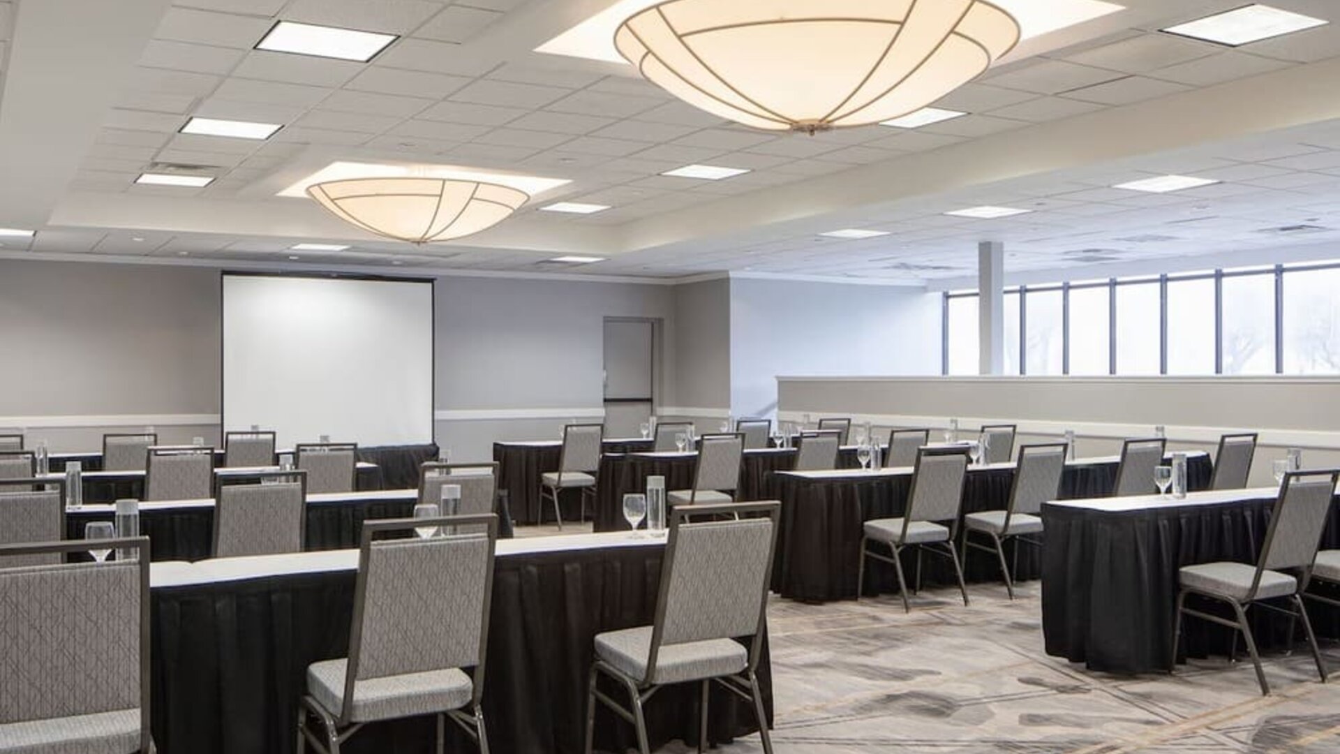 Meeting room featuring classroom-style seating, presentation equipment, and flexible event space at Houston Marriott South at Hobby Airport.