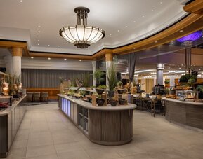 Contemporary hotel buffet area with large selection of meals to choose from. 