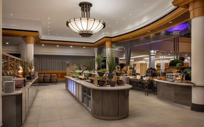 Contemporary hotel buffet area with large selection of meals to choose from. 