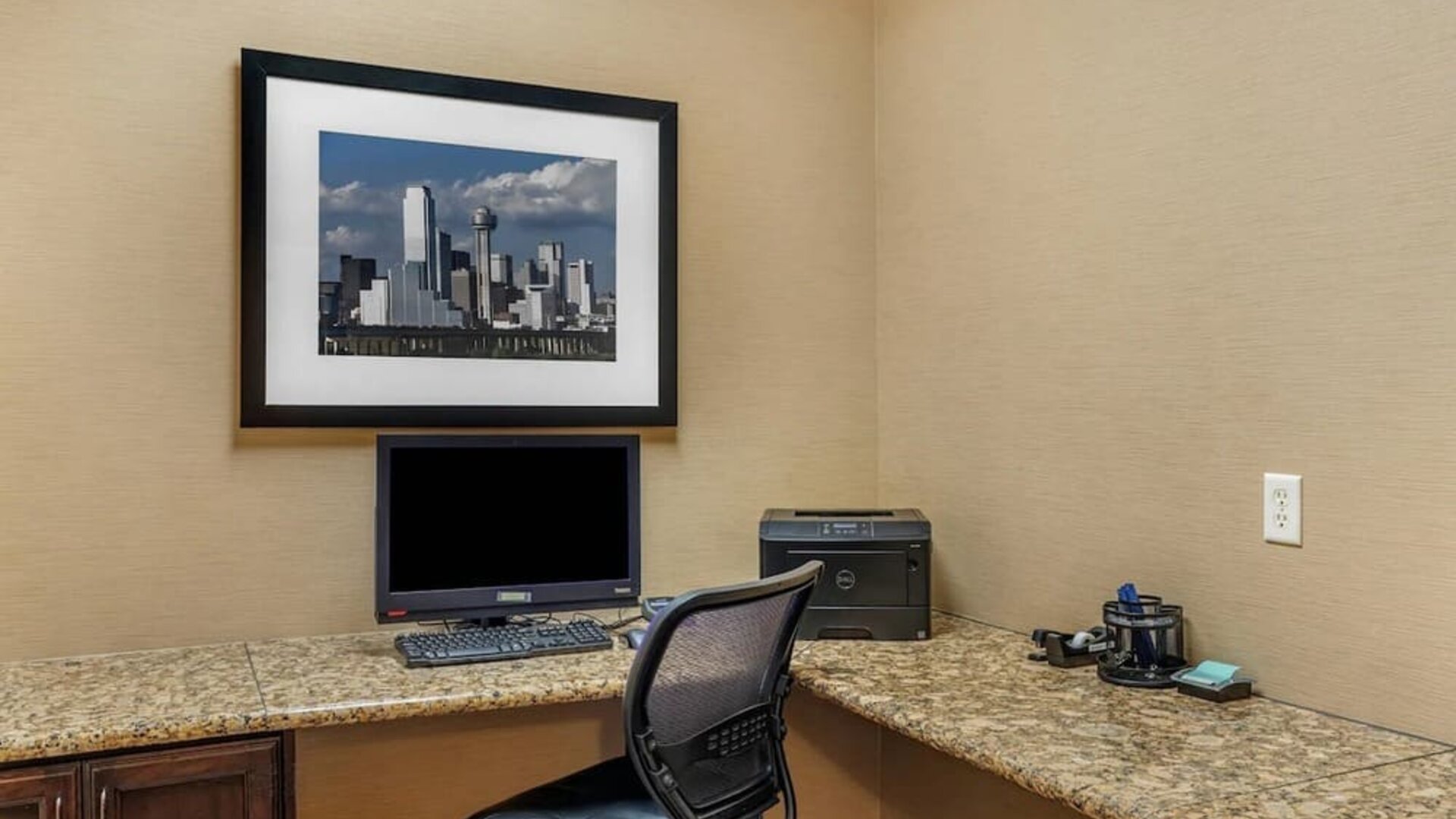 Business centre with a desktop computer, printer, and spacious granite workstations at Comfort Suites Frisco.
