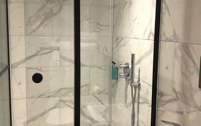 Guest bathroom with shower at Euston Square Hotel.