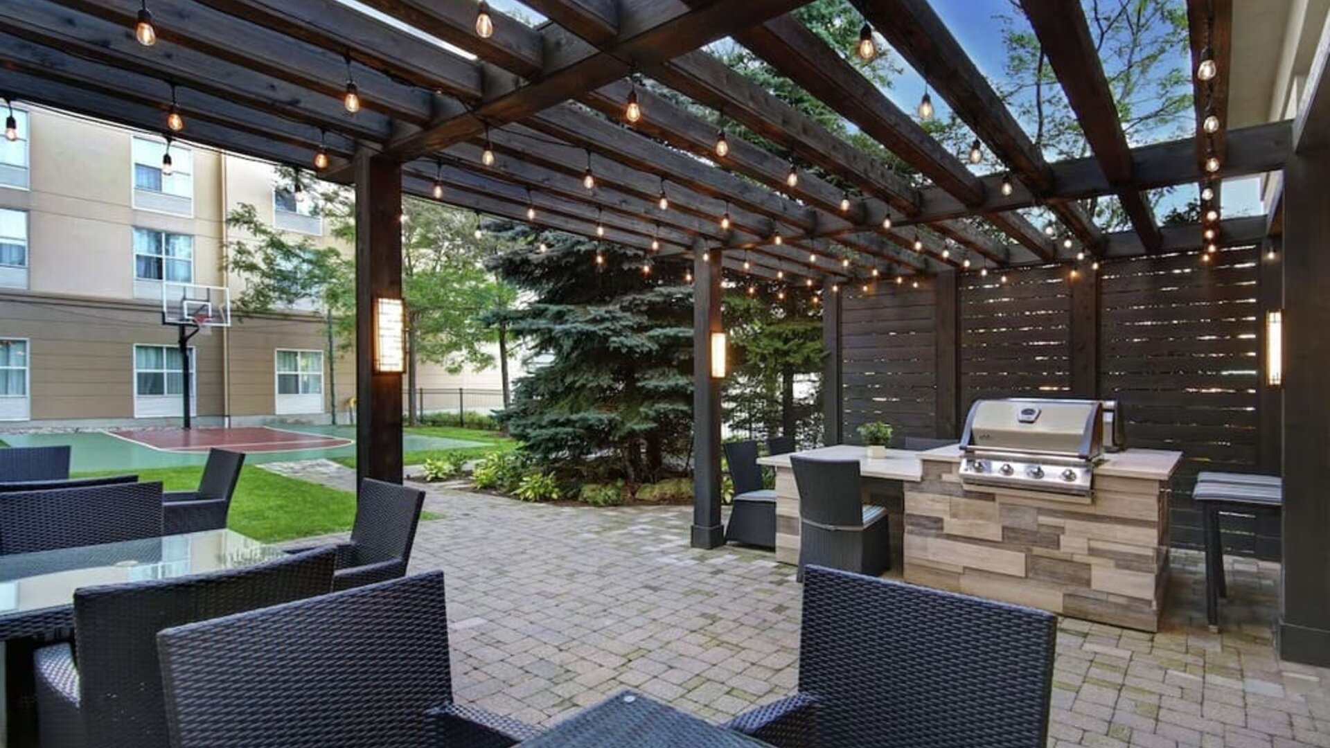 Hotel patio and outdoor lounge area at Homewood Suites By Hilton Burlington.