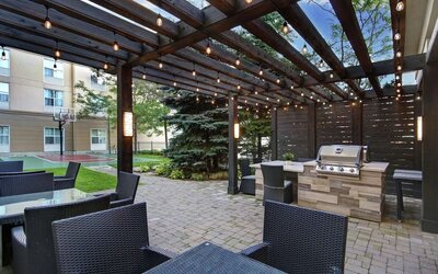 Hotel patio and outdoor lounge area at Homewood Suites By Hilton Burlington.