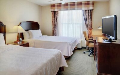 Day use twin room with TV and work desk at Homewood Suites By Hilton Burlington.