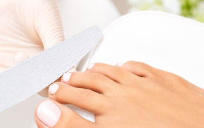 Pedicure treatment at SKYLARANNA Resort & Spa, featuring professional nail care and grooming.