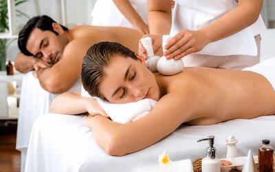 Spa treatment featuring two guests receiving massages in a relaxing treatment setting at SKYLARANNA Resort & Spa.