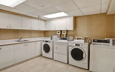Laundry room at Homewood Suites By Hilton Burlington.