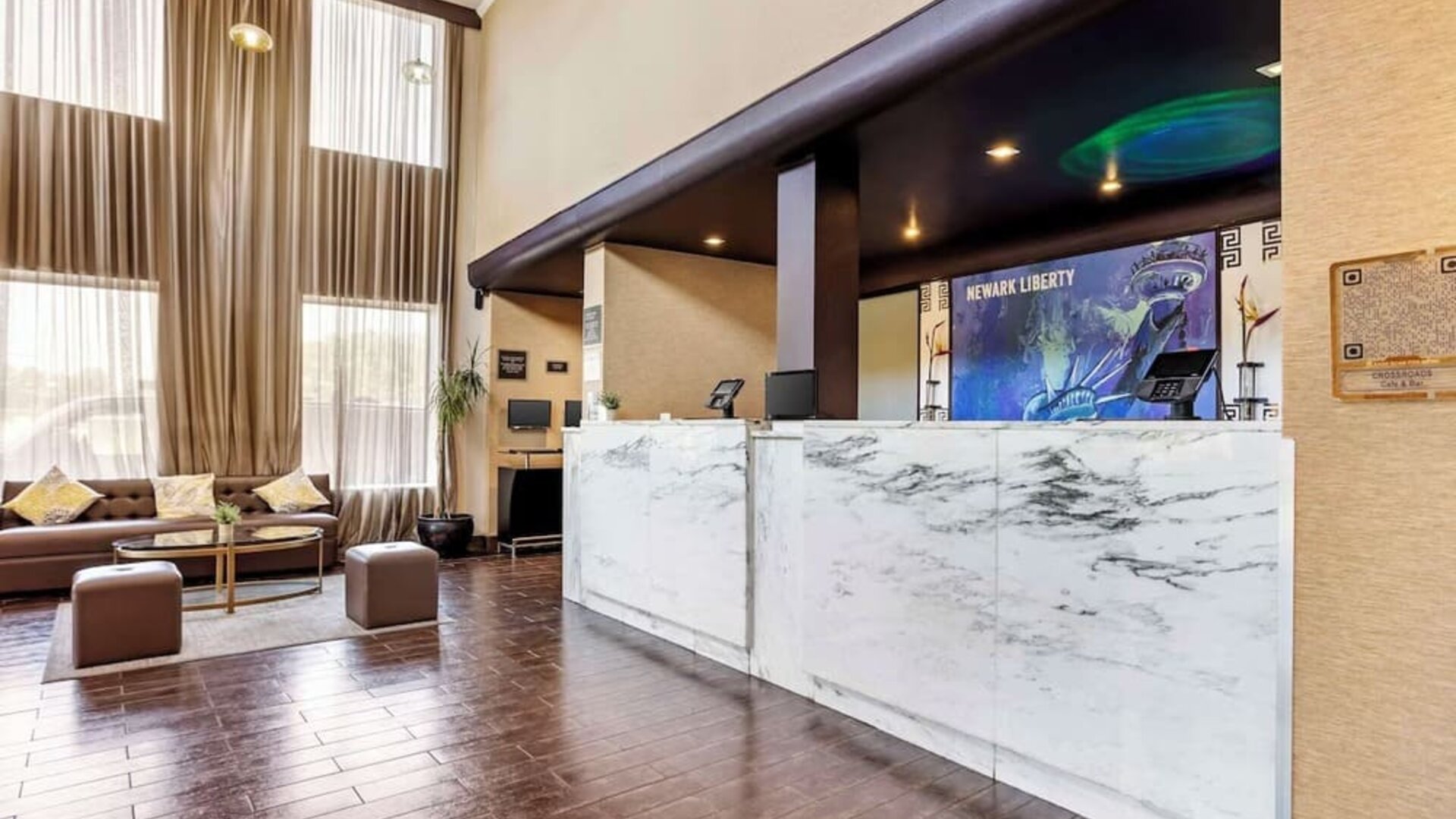 Lobby and coworking lounge at Best Western Plus Newark Airport West.