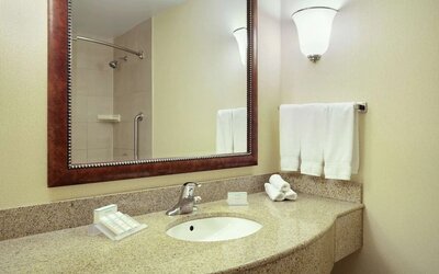 Day use bathroom with shower and toiletries at Hilton Garden Inn Toronto/Burlington.