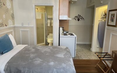 Day use room with private bathroom and in-room kitchen at Parc Suites Hotel.