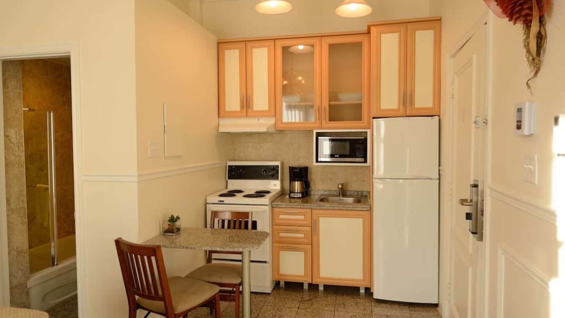 Day use room with private bathroom and in-room kitchen at Parc Suites Hotel.