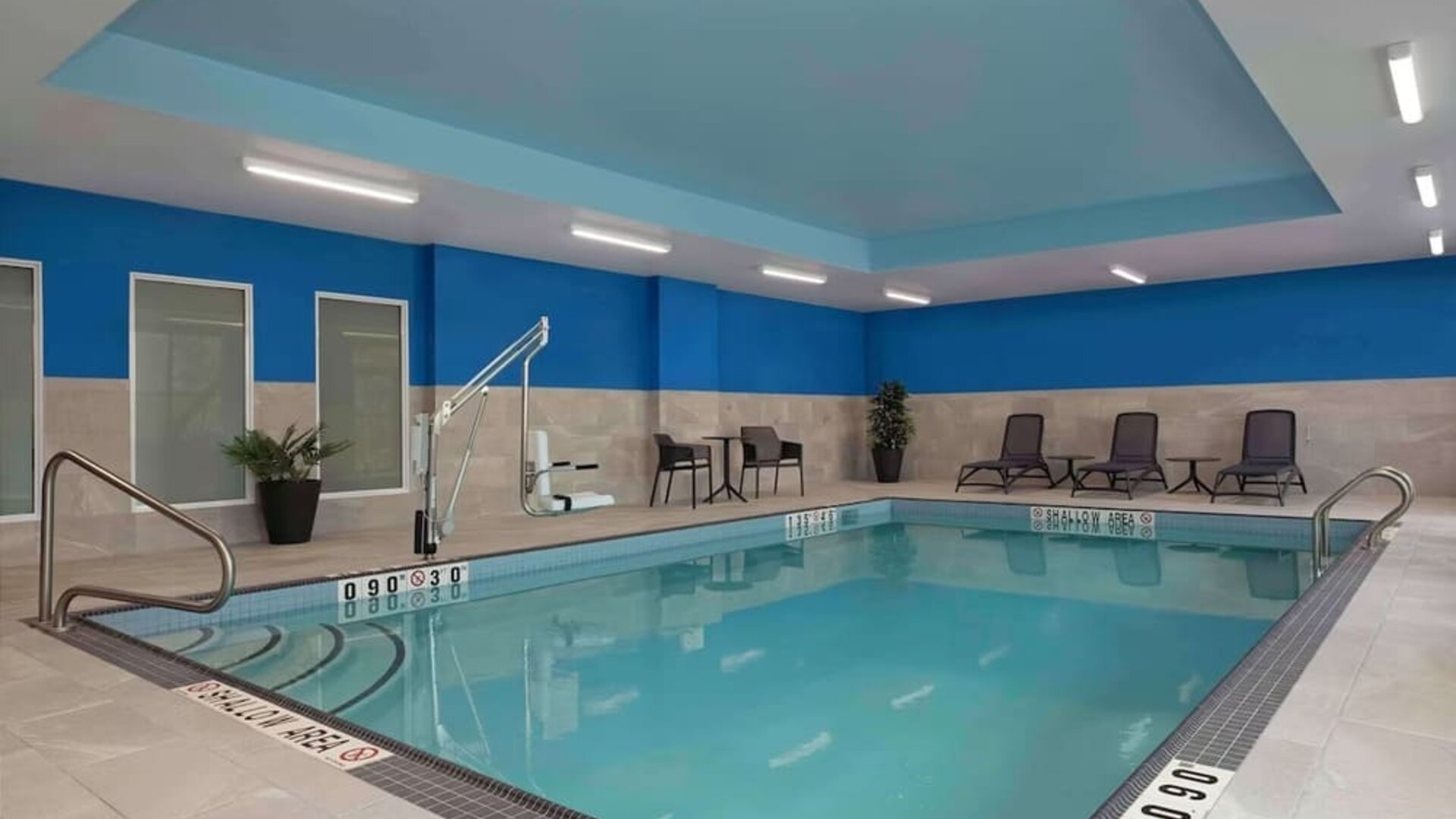 Relaxing indoor pool with lounge area at Hampton Inn By Hilton Port Hope.