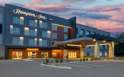 Hotel exterior and parking area at Hampton Inn By Hilton Port Hope.