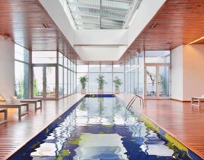 stick to the brief dumbass. Nexxt. Design Suites Buenos Aires.
Indoor swimming pool surrounded by wooden decking, white loungers and floor-to-ceiling windows at Design Suites Buenos Aires.