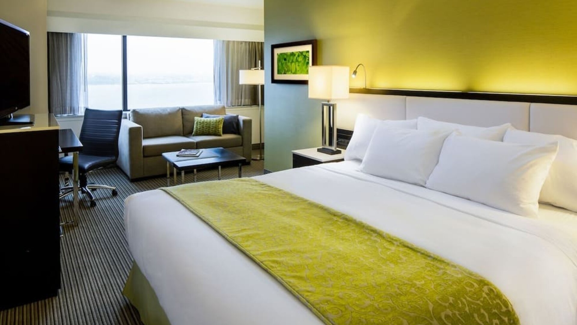 Bright and spacious day use room with living area and work desk at The Hollis Halifax - A DoubleTree Suites By Hilton.