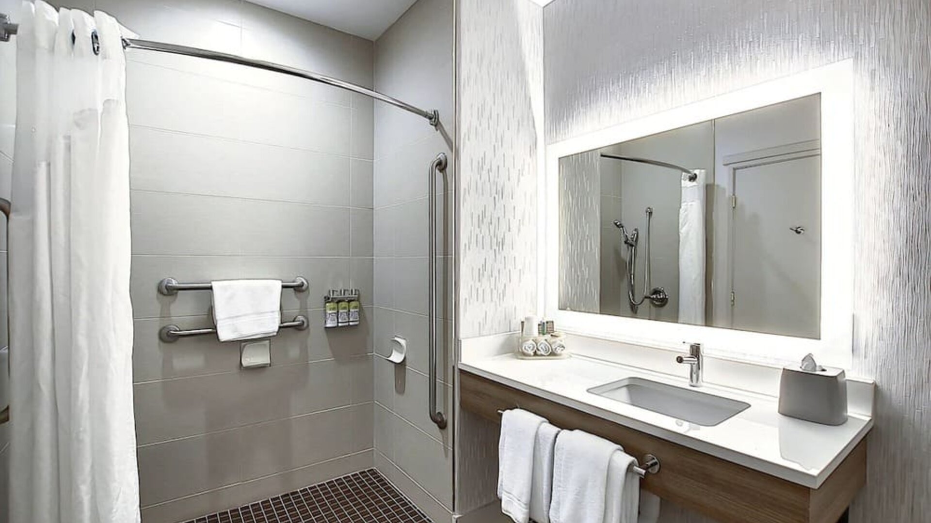 Day use guest bathroom with shower and toiletries at Holiday Inn Express & Suites Airport-Calgary.