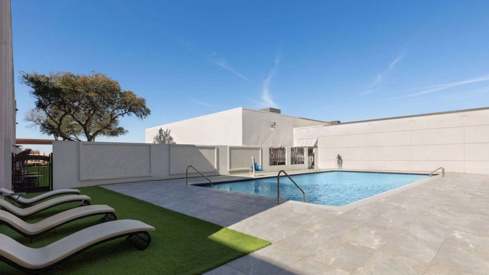 Outdoor pool at Wyndham DFW Airport.