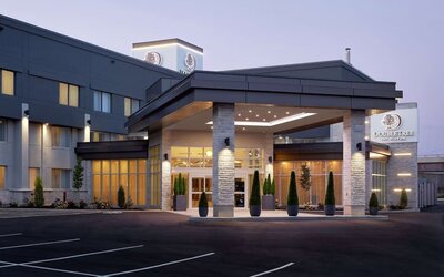 Hotel entrance and parking area at DoubleTree By Hilton Montreal Airport.