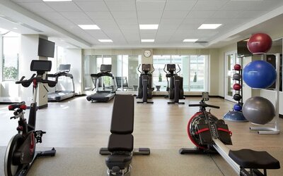 Fully equipped fitness center at DoubleTree By Hilton Montreal Airport.