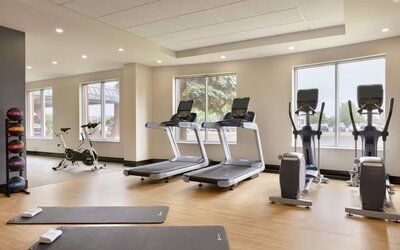 Fully equipped fitness center at the Embassy Suites by Hilton Montreal Airport.