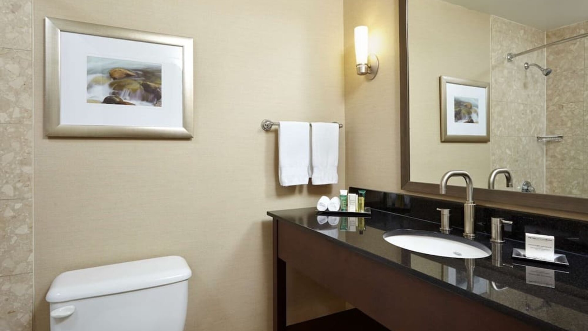 Private bathroom with shower and toiletries at the Hilton Saint John.