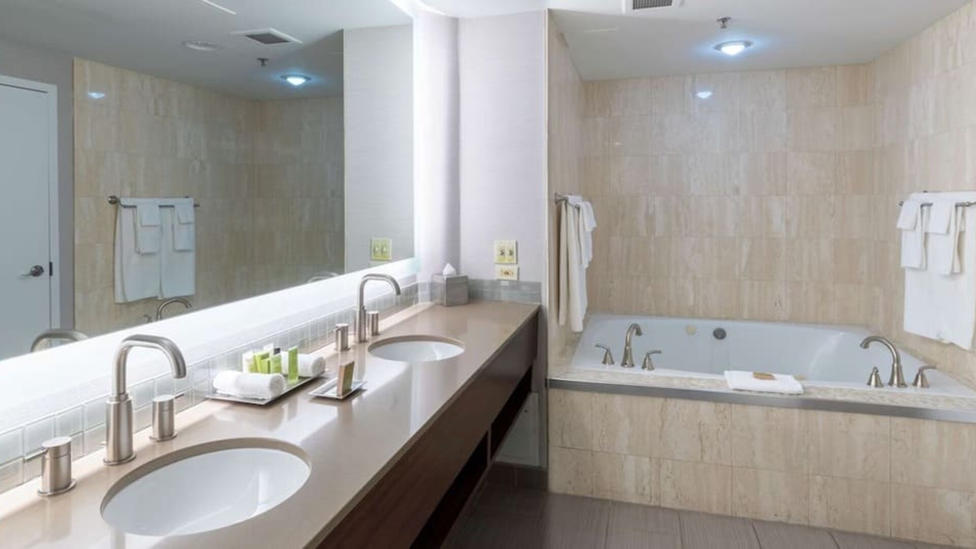 Private bathroom with tub and toiletries at the Hilton Saint John.