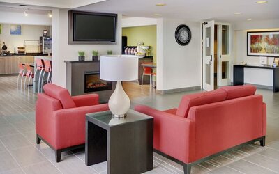 Lobby and coworking lounge at Comfort Inn Sudbury East.