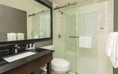 Guest bathroom with shower at Comfort Inn Sudbury East.