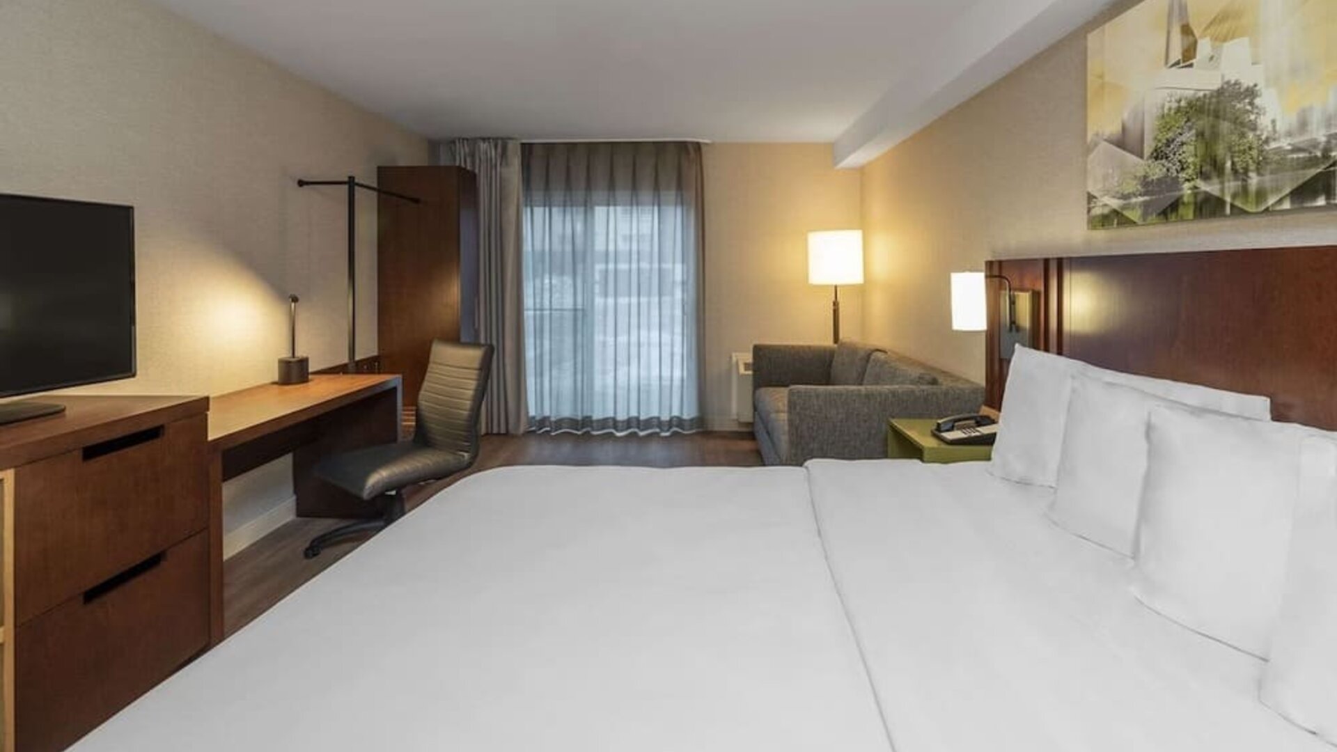 Day use room with work desk and sofa at Comfort Inn Sudbury East.