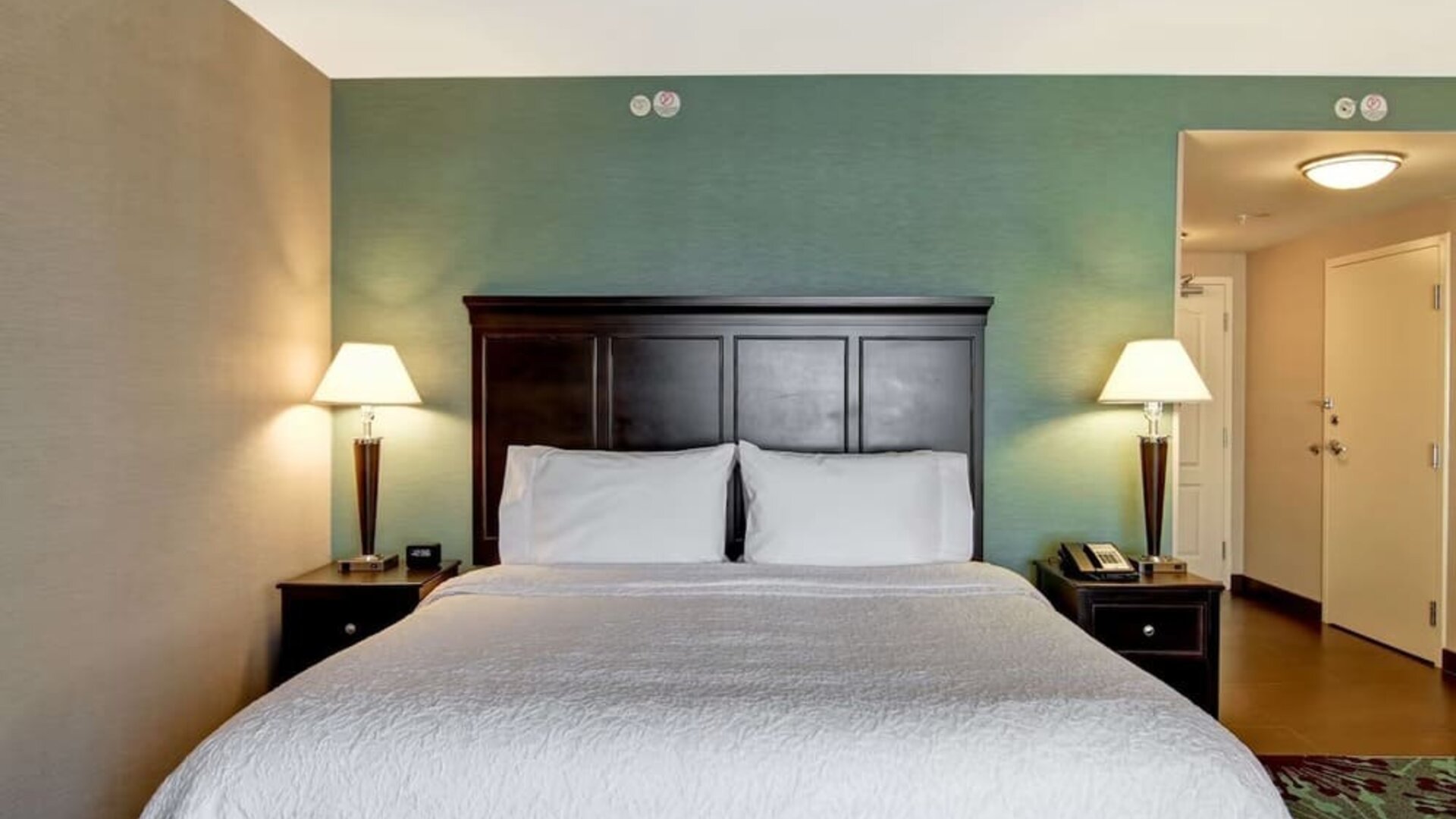 King bed at Hampton Inn By Hilton Toronto Airport Corporate Centre.