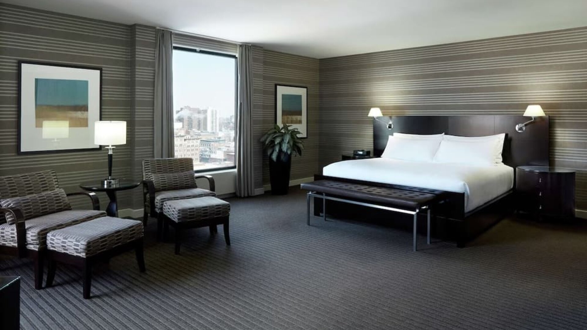 Day use room with work desk, lounge area and private bathroom at DoubleTree By Hilton Montreal.