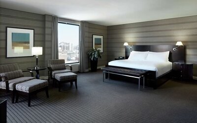 Day use room with work desk, lounge area and private bathroom at DoubleTree By Hilton Montreal.