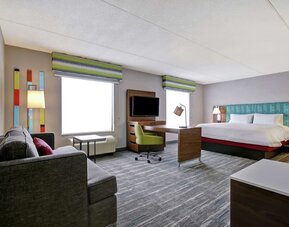 Day use studio suite with work station, lounge area and lounge area at the  Hampton Inn & Suites By Hilton Guelph.