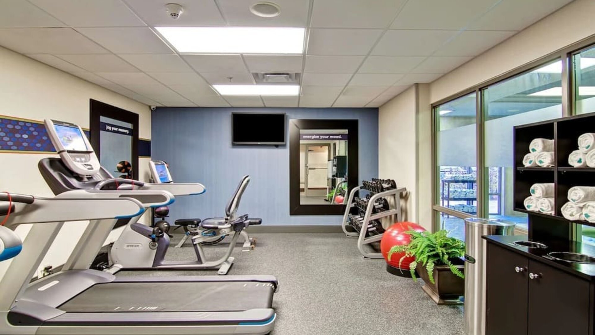 Fully equipped fitness center at the  Hampton Inn & Suites By Hilton Guelph.