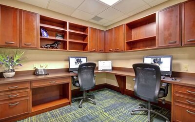 Professional business center with compuerts, printer and ergonomic chairs at the  Hampton Inn & Suites By Hilton Guelph.
