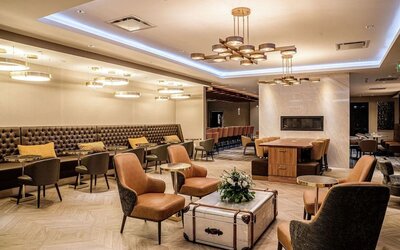 Dining area with comfortable seating, perfect for co-working at DoubleTree By Hilton Kitchener.